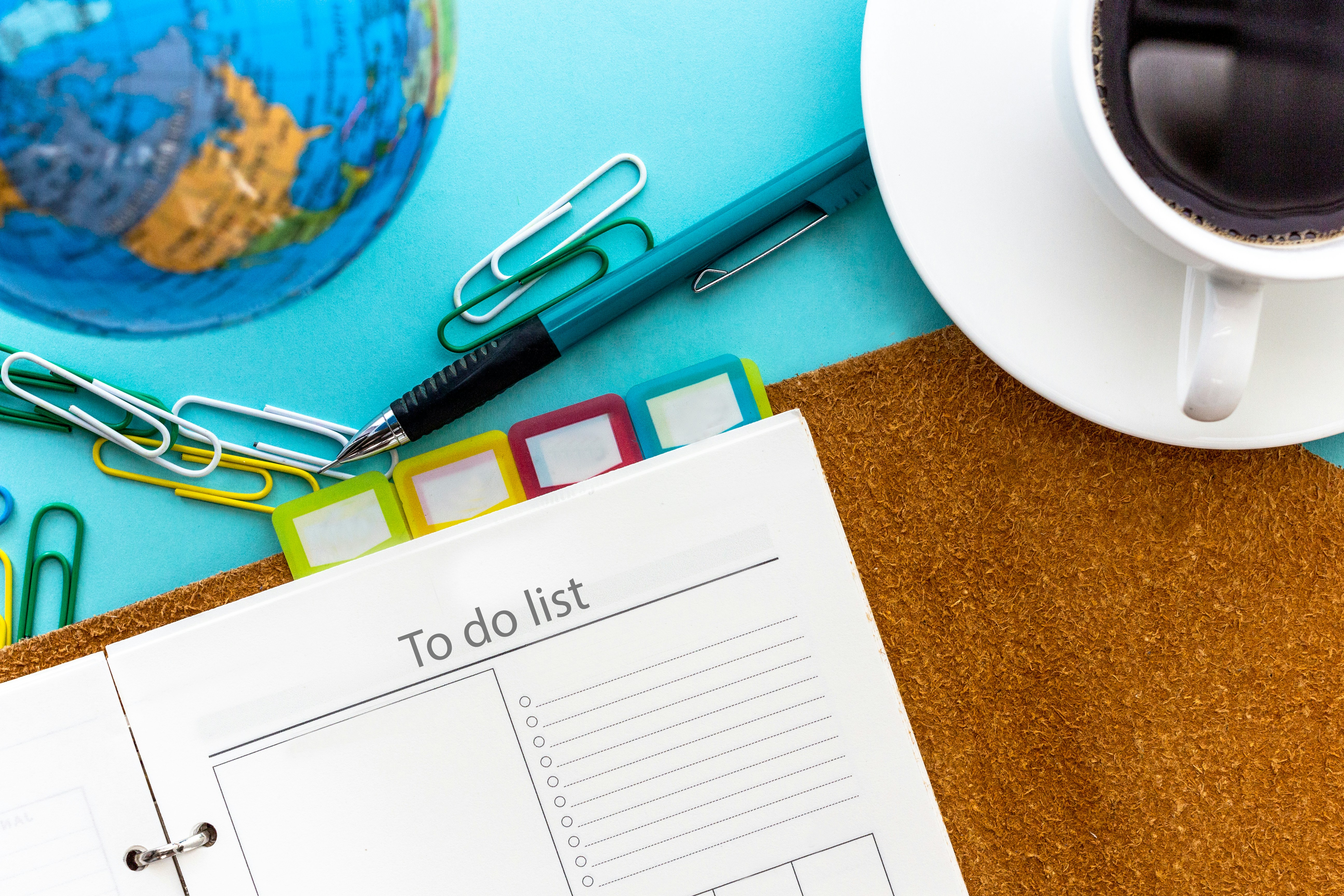 a calendar and scissors on a table